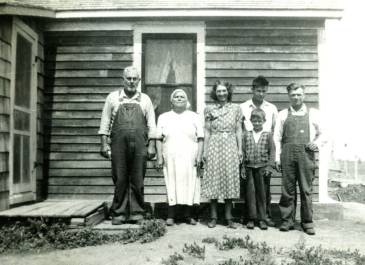 Max 1940 - "Kid in the front is my dad (Archie Zahursky), lady in the middle my Grandma (Nellie), man on the right side with bibs, my Grandpa (George)" - Anita Hoffman, NDHFA Employee