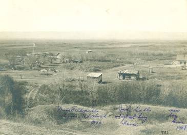 McKenzie County 1908 - Pioneer Museum of McKenzie County Collection - Hilltop view of Nina Falkedahl's homestead shack, Jack Dahl's original log house and new log home