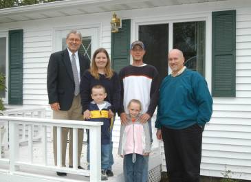 Lincoln - 30,000th NDHFA Home Loan - Dave Flohr and Mike Anderson with Zacher Family 