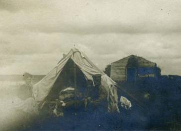 Pierce County 1915 - Pierce County Tribune Records Family outside tent, sod house in ground