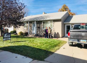 Williston - "This is my parents in front of there first house they bought in the 1980s. They raised all their kids in it and just sold it here in 2021" Kayla Axtman, NDHFA Employee