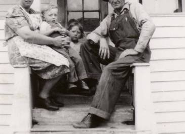 St. Anthony 1940's - "my Grandma and Grandpa Bullinger with my Uncle Lawrence and Aunt Marlene on the front porch of the house." Nicole Faul, NDHFA Employee