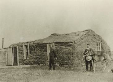 1910 - SHS A-A Collection - Sod house with glass windows and frame lean-to